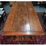 A substantial solid oak refectory table, 242 cm x 104 cm x 74 cm