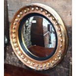 A giltwood and gesso framed convex mirror