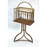 A vintage oak and brass framed magazine rack