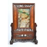 A Chinese jade or other hardstone table screen in hardwood frame, probably late Qing, 30 cm high