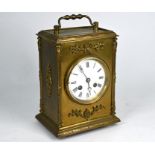 A late 19th century brass mounted inlaid mantel clock