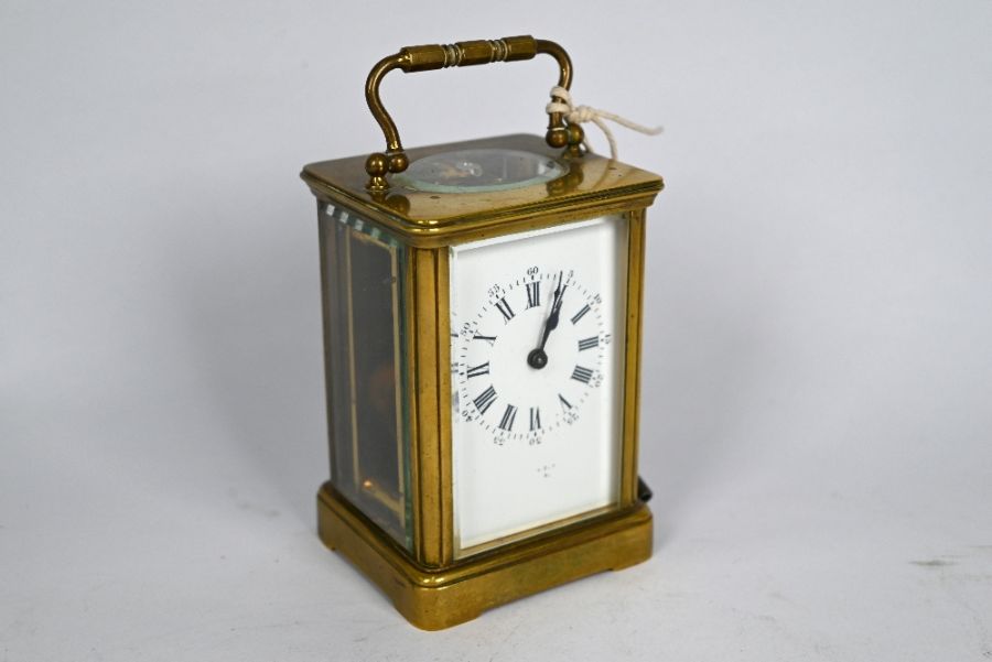 A late 19th century brass carriage clock with signe train 8-day movement