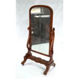 A Victorian mahogany cheval mirror