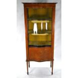 A serpentine fronted glazed red walnut display cabinet
