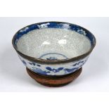 A 19th century Chinese blue and white crackle glaze bowl with Qianlong mark, c/w hardwood stand