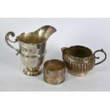 Two silver jugs & napkin ring
