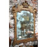 An antique George I style giltwood and gesso framed mirror