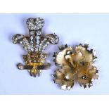 Two gilt metal costume brooches