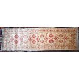 An Indian Agra carpet runner, 280 cm x 83 cm