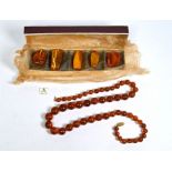 Amber necklace and loose specimens