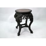 An antique Chinese hardwood jardiniere stand