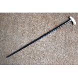 An antique ivory walking stick handle