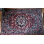 An antique Persian Kashan rug, signed and dated
