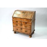 A William & Mary period feather-banded walnut bureau