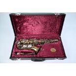 A cased Boosey & Hawkes alto saxophone