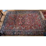 An antique Persian Heriz carpet, 218 cm x 200 cm