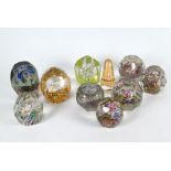 Ten faceted cut glass paperweights