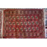 An old Afghan Turkoman gul design rug, 180 cm x 122 cm