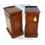 A pair of mahogany bedside cabinets