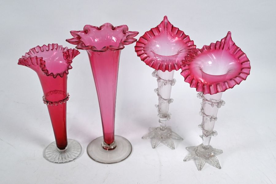 Four various cranberry vases