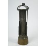 A 19th century brass miner's safety lamp