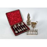 Silver teaspoons, toast-rack, caster and jug