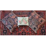 A pair of old Sumak faced carpet cushions, a tapestry cushion and a small rug (4)