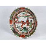 A Chinese wucai dish painted with dignitaries, Kangxi period (1662-1722)