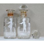 A pair of cut glass scent bottles and stoppers