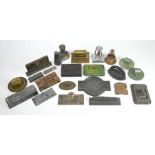 Twenty-three various metal advertising paperweights