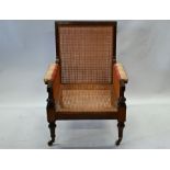A pair of heavy traditional studded brown leather club armchairs (2)
