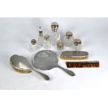 Silver four-piece dressing table set & scent bottles