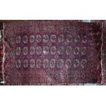 An antique Turkomen rug, 204 cm x 128 cm