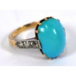 A turquoise and diamond ring