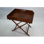 A Victorian mahogany butler's tray on folding stand