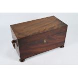 An antique mahogany tea caddy