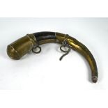 An antique Arab brass and wood powder horn