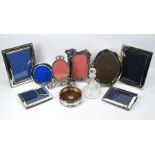 Four silver-mounted photograph frames, etc.