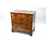 An 18th century feather-banded walnut chest of drawers