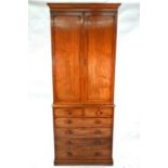 A Victorian mahogany two part cabinet on chest