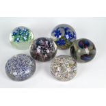 Six various floral paperweights