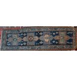 An antique Kurdish runner, 326 cm x 94 cm