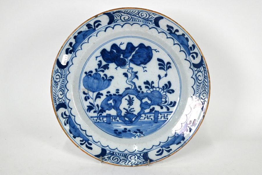 A 19th century Delft tin-glazed earthenware blue and white charger - Image 2 of 3