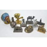 Ten various vintage metal advertising paperweights