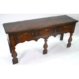 A 17th century oak low dresser