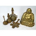 A large brass Budai figure and four Tibetan hand bells