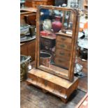 A George III walnut toilet mirror on three drawer base