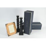 A boxed pair of Linley ebonised twist-pillar candlesticks