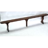 A companion pair of antique French fruitwood and pine benches