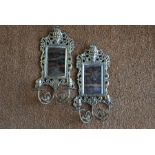 A pair of Continental cast brass girandole mirrors